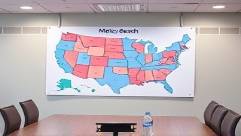 illustrative Medicaid coverage map, demonstrating policy reach, pinned on a wall, photorealistic, in a conference room with seating arrangements visible, highly detailed, gentle air conditioner hum in the background, pastel hues for clarity, ambient office lighting, shot with a tilt-shift lens